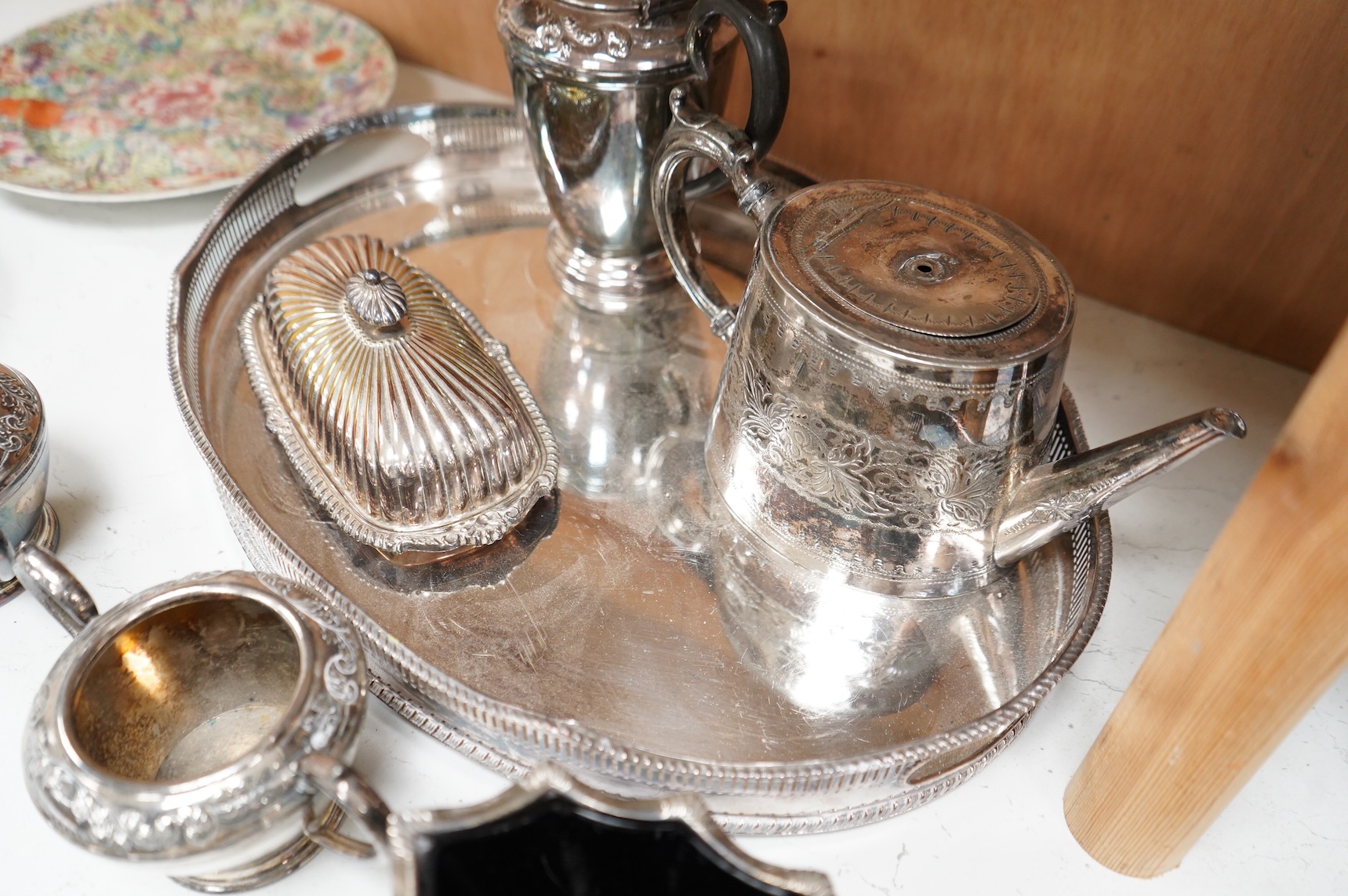 A quantity of plated wares to include a galleried tray, teapot, jug and bon bon dish with glass liner, largest 45cm wide
